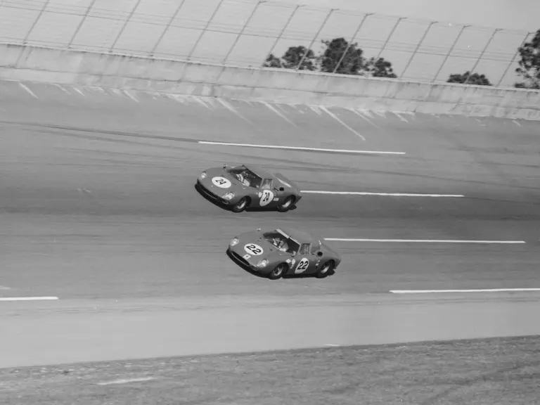 Chassis no. 5893, #22 (bottom car), at the 1966 24 Hours of Daytona driven by Bob Bondurant and Jochen Rindt.