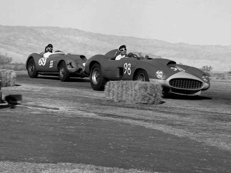 Dan Gurney, behind the wheel of chassis no. 0478 AM (#69), chasses down Carroll Shelby in John Edgar's Ferrari 410 Sport Spider (#98) at Palm Springs on 13 December 1958. Gurney would go on to finish 1st overall in the main event race.