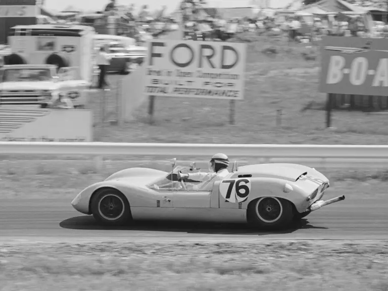 Don Wester wrestles with the steering wheel of 70P/032 at Watkins Glen, 1964.