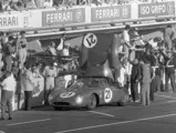 Chassis no. 5893 in the NART pit at the 1965 24 Hours of Le Mans. Jochen Rindt (helmet) awaits to rejoin the race. To his right is co-driver Masten Gregory.