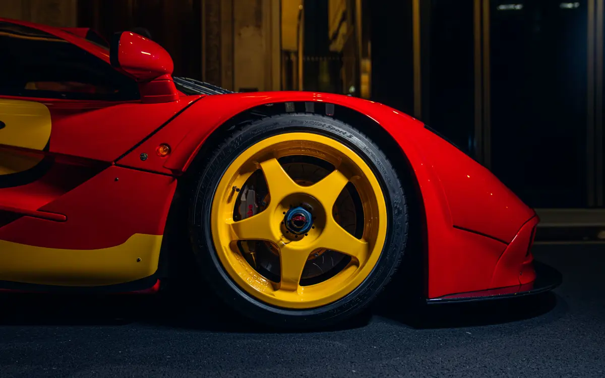 Bright yellow rims on the 1996 McLaren F1 GTR wheels complement its distinctive factory livery.