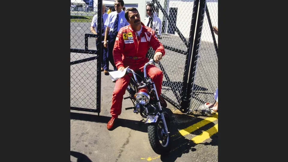 Nigel Mansell captured going through a gate at Silverstone Circuit before the 1990 British Grand Prix, he went on to claim pole position and set the fastest lap.