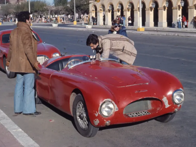 Taken in Buenos Aires, the 202 SC Coupe sits behind another Cisitalia on the way to a rally in 1972.