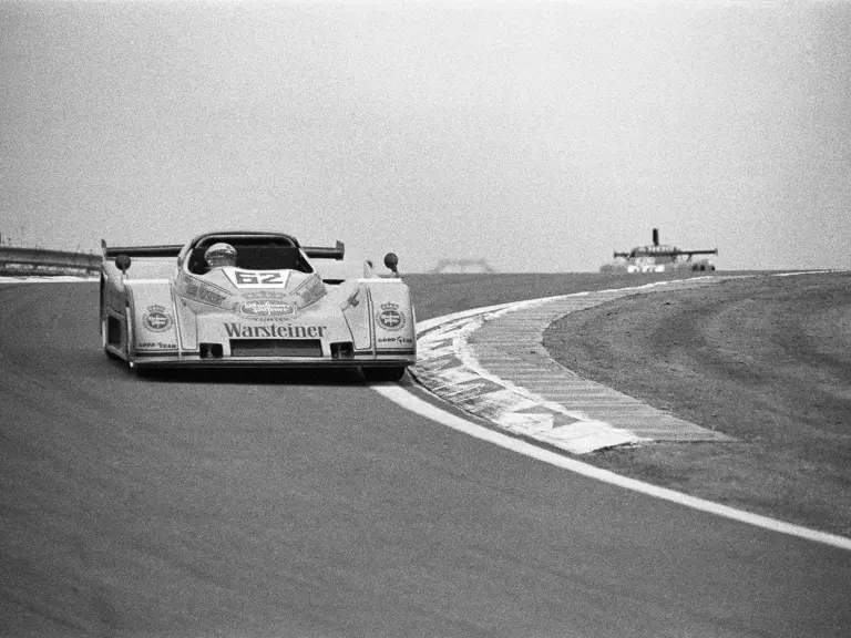 Car number 62, the TOJ SC304 driven by Rolf Stommelen, crests the hill at the 1976 Dijon 500 km.