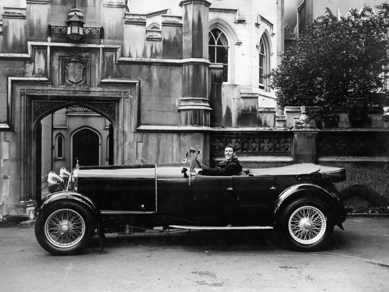 The Lagonda captured with a beaming driver, thought to date from the late 1950s, early 1960s.