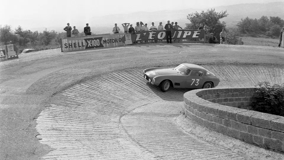 Driven by Alfonso de Portago, chassis 0557 GT rounds a banked corner on the 1956 Tour de France.