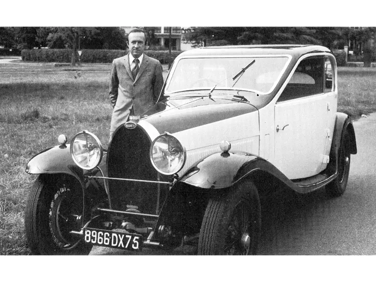 Former owner Philippe Vernholes stands with the Bugatti.