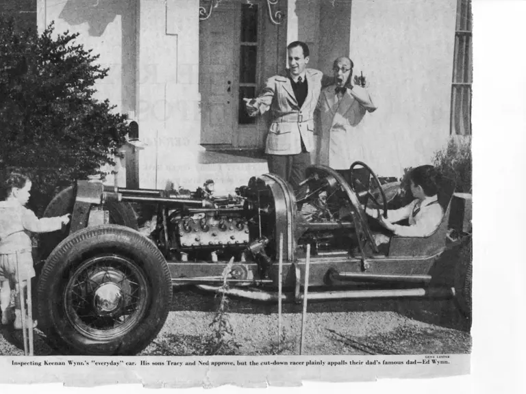 A famous show business family: Hollywood actor Keenan Wynn looks on with his famous comedian father, Ed, as his sons play around with his Welch Special in the 1940s. Tracy would grow up to be a screenwriter whose credits include The Longest Yard.