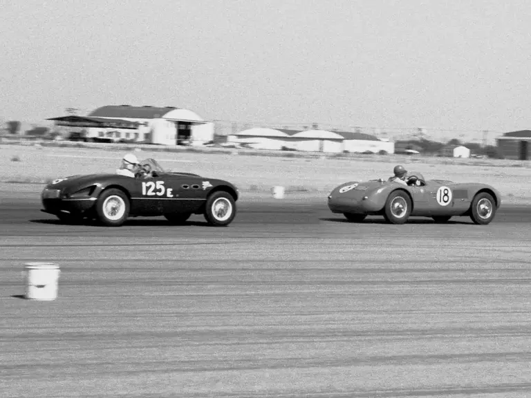 The Vignale-bodied Ferrari 166 (0342 M) piloted by Bill Louden chasing XKC 007 at Bakersfield in May of 1956.