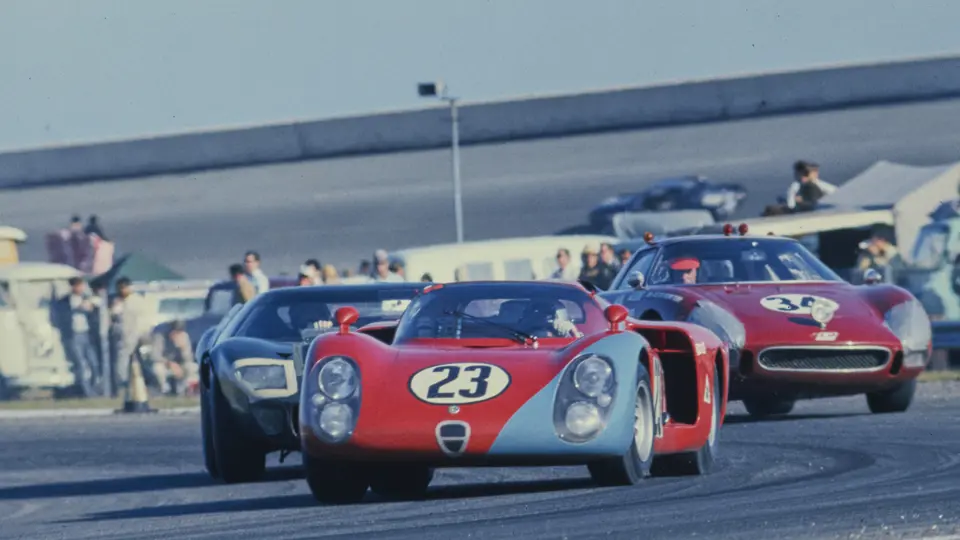 Chassis no. 015, race #23, leads a Ford GT40 and a Ferrari 250 LM through a turn at the 1968 24 Hours of Daytona.