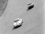 Chassis number 750061 (#27) leads an Autodelta Alfa Romeo Giulia Sprint GTA (#56) through the high bank at Monza in the 1965 1000 KM of Monza.