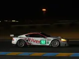 The number 52 Aston Martin DBR9 was piloted by Kox, Enge, and Nygaard during the 2010 24 Hours of Le Mans.