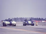 Chassis 003, race #1, driven by Delmo Johnson/Dave Morgan/Ed Sevadjian, leads Shelby American’s Shelby Cobra Daytona, race #14, driven by Bob Johnson and Tom Payne, at the 1965 Sebring 12 Hours.