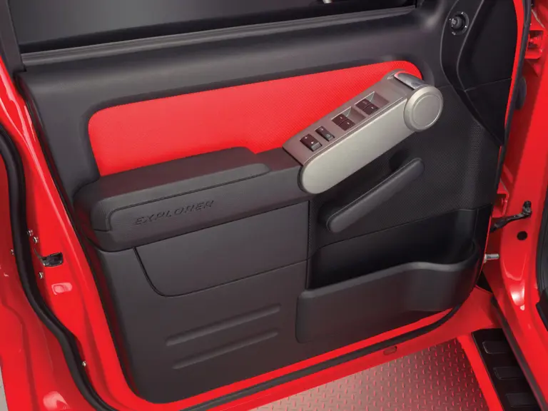 Ford Sport Trac Adrenalin teaser: Ford Sport Trac Adrenalin red-leather interior door trim matches the red seat inserts. 

