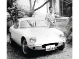 Hirotoshi Honda is pictured with the Lotus after its first rebuild, refinished in white.