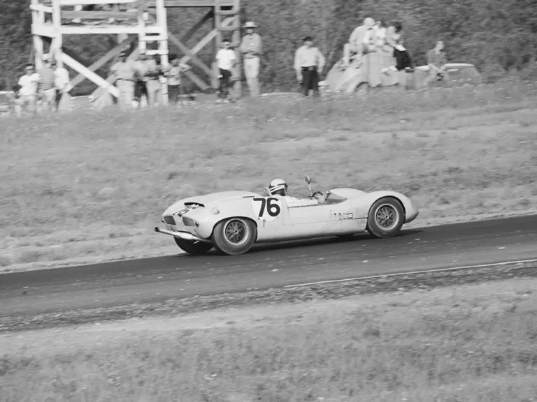 Don Wester wrestles with the steering wheel of 70P/032 at Watkins Glen, 1964.