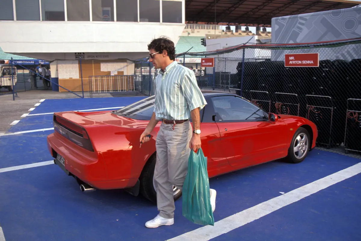 Ayrton Senna arrives at Circuito Estoril for the 1991 Portuguese Grand Prix in his Honda NSX.