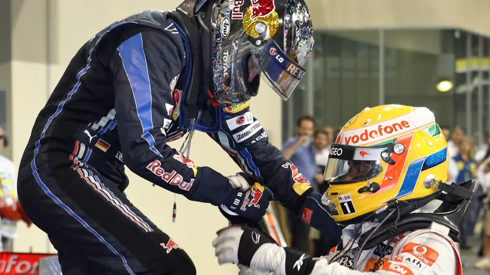 Lewis Hamilton congratulates Sebastian Vettel upon winning his first Formula 1 Drivers' Championship at the 2010 Abu Dhabi Grand Prix.