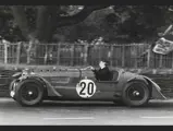Rob Walker behind the wheel at he hurtles through a corner at the 1939 24 Hours of Le Mans.