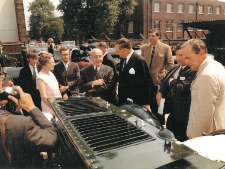 Please can you extract the images from this sheet to make three standalone images. They can all take the same caption: “W.O. Bentley is seen with chassis YR5077 at a period Bentley meet, date unknown.