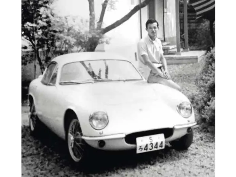 Hirotoshi Honda is pictured with the Lotus after its first rebuild, refinished in white.