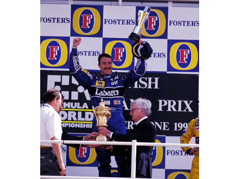 Race winner Nigel Mansell (GBR) Williams celebrates on the podium.
Formula One World Championship, Rd9, British Grand Prix, Silverstone, 12 July 1992.