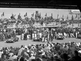 Chassis 0546 LM captured in the Le Mans pit lane alongside the three Works Jaguar D-Types.