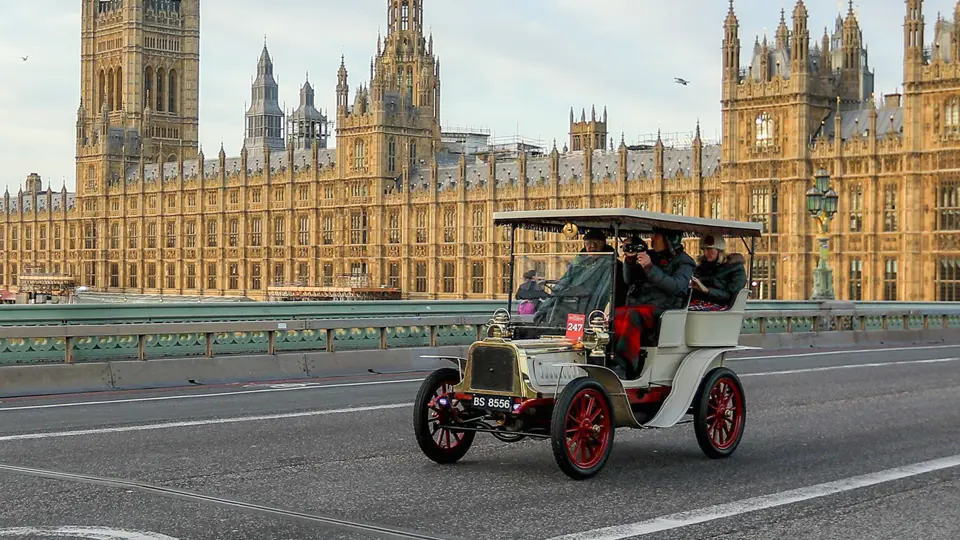The Houses of Parliament overlook Westminster Bridge at the start of the 2021 London to Brighton Veteran Car Run.