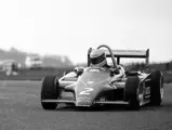 Ayrton Senna at speed in the Ralt RT3 during the British Formula 3 race at Thruxton in November 1982, where he finished first.