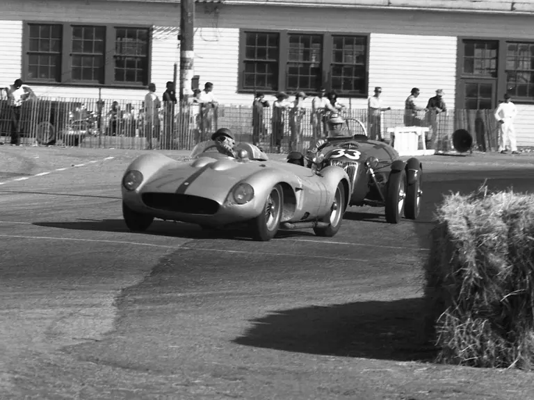Richie Ginther behind the wheel of chassis no. 0680 MDTR (race #11) leads a Frazer-Nash (race #33) at the Santa Barbara Road Races, 1958.