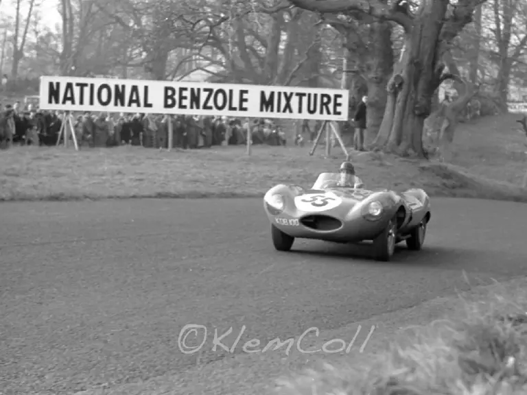 The #55 D-Type powers up the hill and past the crowds at the British Empire Trophy Meeting, Oulton Park, 6 April 1957.