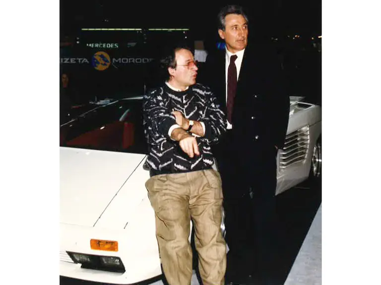 Giorgio Moroder and Claudio Zampolli leaning on the Cizeta-Moroder V16T at the 1989 Genva Auto Salon.