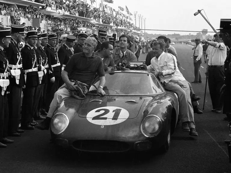 Chassis no. 5893 following the triumphant first overall finish for Luigi Chinetti’s NART team at the 1965 24 Hours of Le Mans. Masten Gregory behind the wheel and co-driver Jochen Rindt in the passenger seat.