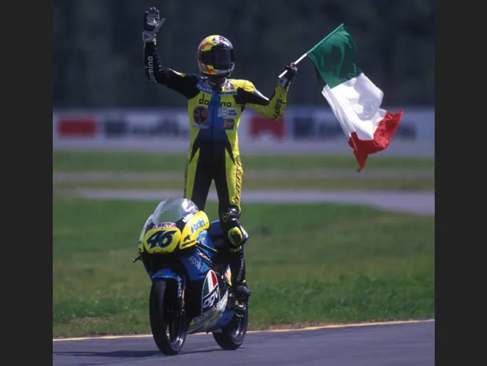 Rossi stands on chassis 1291195 having claimed his first career victory on this 125cc Aprilia racing motorbike.