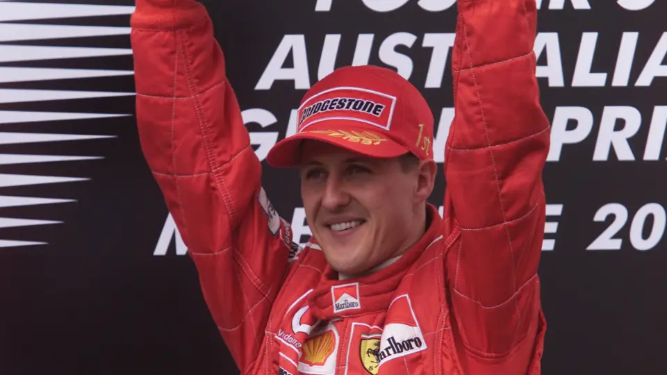 Michael Scumacher holds aloft the winner’s trophy after finishing 1st at the 2002 Austrialian Grand Prix.