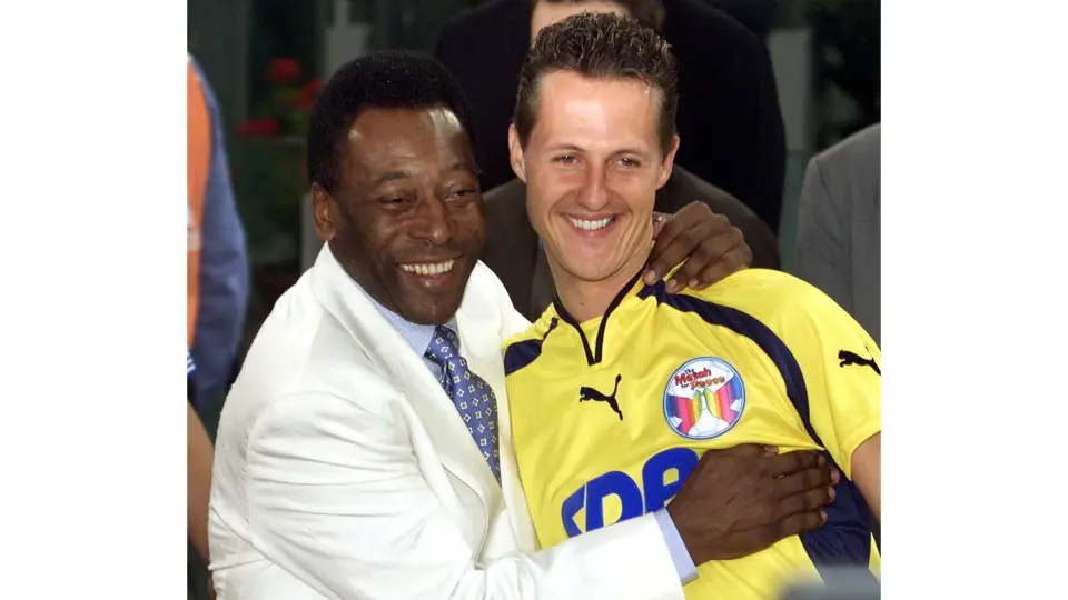 Michael Schumacher next to football legend Pele during the 2000 Match for Peace. This image is for reference purposes only.