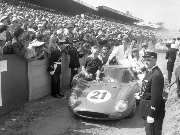 Chassis no. 5893 following the 1965 24 Hours of Le Mans where it achieved a first overall finish for Luigi Chinetti’s NART team. Masten Gregory behind the wheel, co-driver Jochen Rindt on the roof.