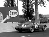 Trackside spectators at the 1955 24 Hours of Le Mans are treated to an aural assault as chassis 0546 LM powers past a sand trap.