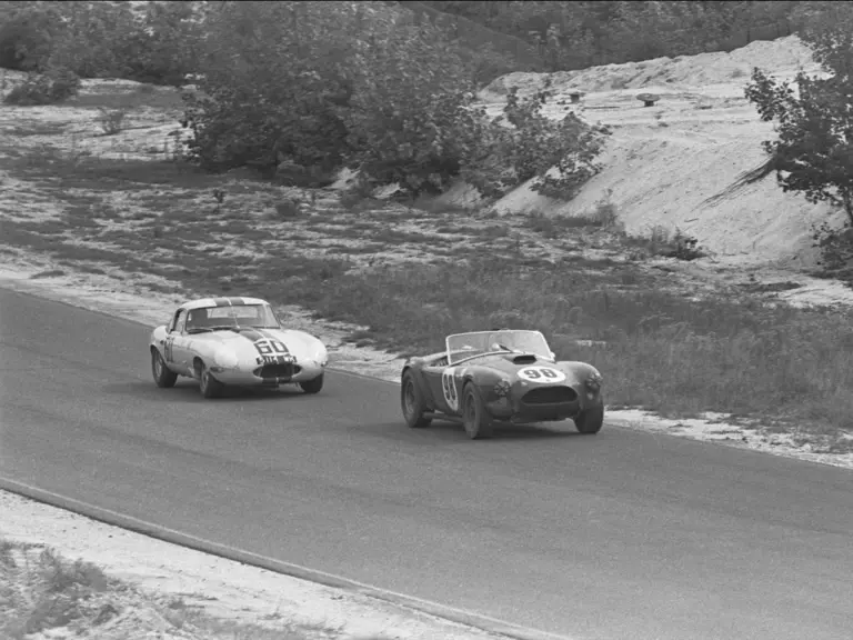 Ken Miles and CSX 2129 ahead of Briggs Cunningham in the #60 Jaguar E-Type at the Bridgehampton Double 500, September 1963.