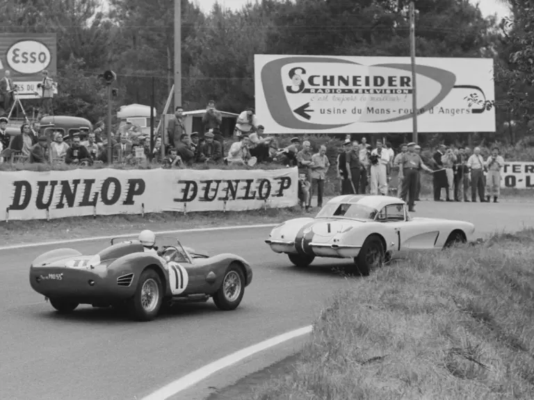 The #1 Corvette is pursued by the eventual race-winning #11 Ferrari TR59 of Olivier Gendebien and Paul Frère.