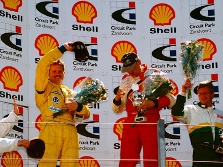 René Snel (right) celebrates on the podium having finished in 3rd place at the Super Car Cup event at Zandvoort in May 1998.