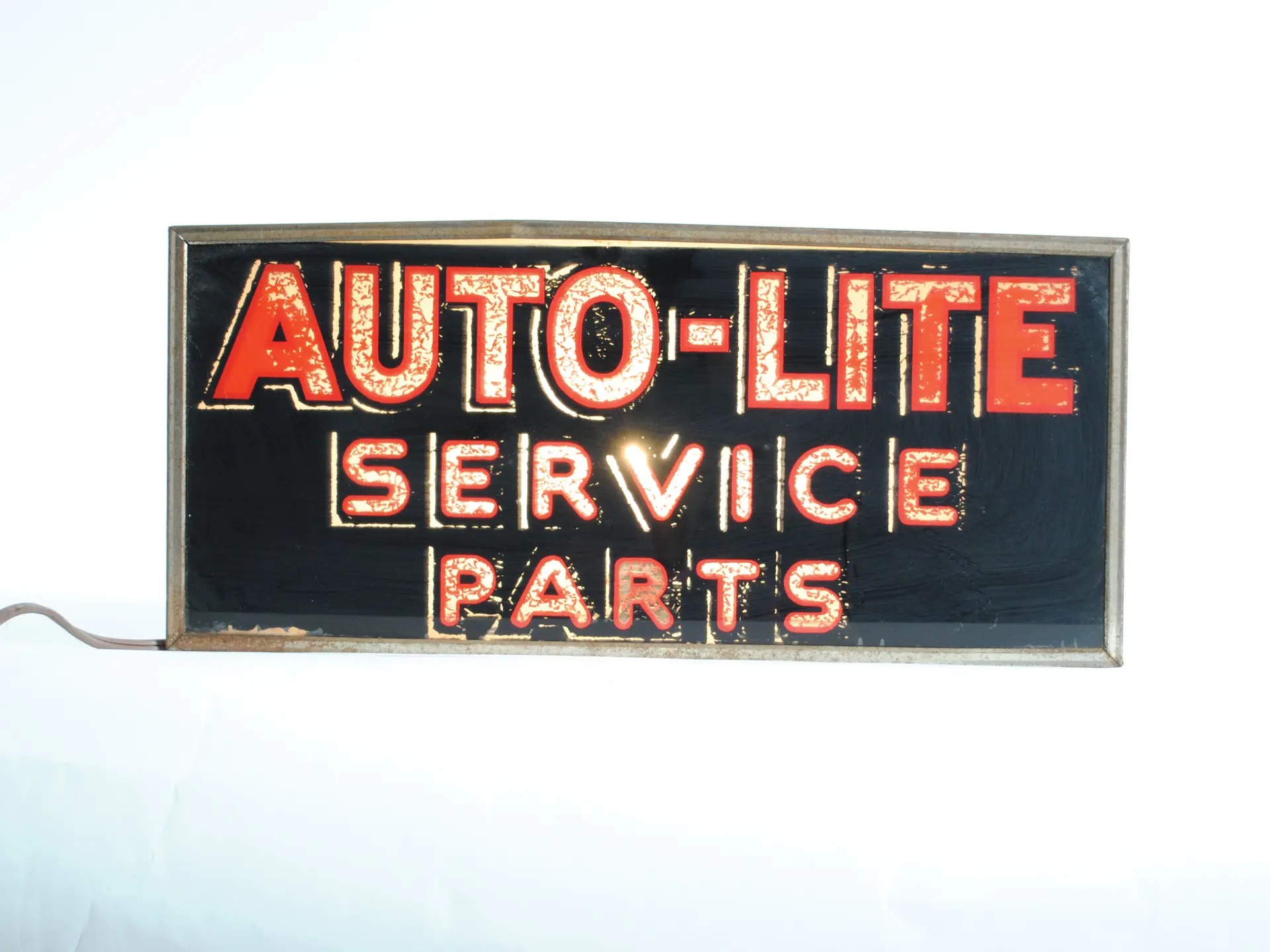 A vintage Auto-Light Service Parts illuminated sign. 18