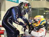 Lewis Hamilton congratulates Sebastian Vettel upon winning his first Formula 1 Drivers' Championship at the 2010 Abu Dhabi Grand Prix.