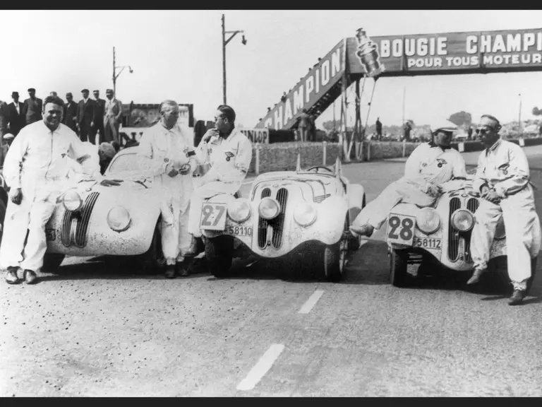 The victorious NSKK team with their cars after the 1939 24 Hours of Le Mans race. From left to right: Hans Wencher, Ralph Roese, Paul Heinemann, Willi Briem, and Rudolf Scholz.