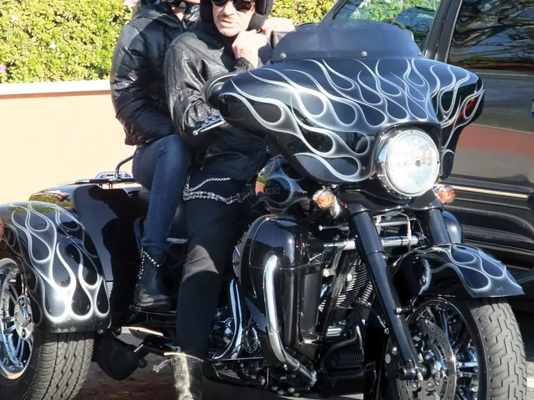 Johnny Hallyday and his wife Laeticia on their Harley-Davidson in Malibu, California in 2011.