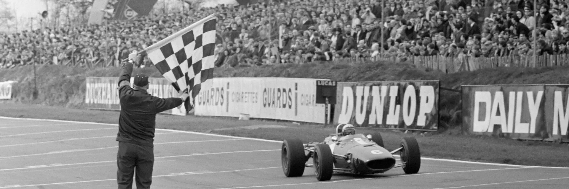 Rich Ginther crosses the line at the 1967 Race of Champions at Brands Hatch.