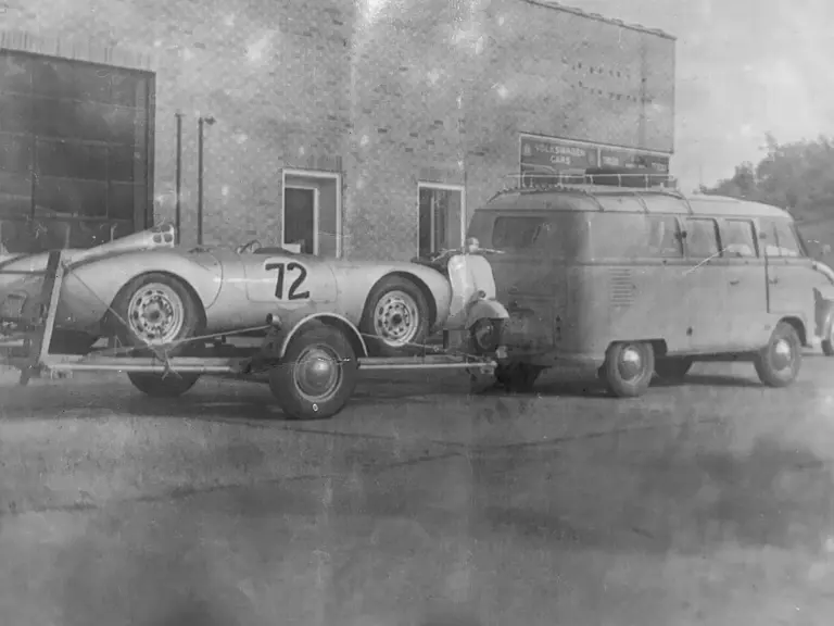 The Porsche 550 Spyder is loaded onto a trailer by Jack Manting, pictured on its way to a race outing.