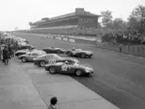 NüRBURGRING, GERMANY - MAY 27: Phil Hill / Olivier Gendebien, SEFAC Ferrari, Ferrari Dino 246 SP 0790 alongside Willy Mairesse / Mike Parkes, SEFAC Ferrari, Ferrari 330 LM/GTO 3673SA and Dan Gurney / Jo Bonnier, Porsche System Engineering, Porsche 718 GTR 046 at the start during the Nurburgring 1000 kms at Nürburgring on May 27, 1962 in Nürburgring, Germany. (Photo by LAT Images)