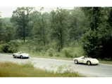 Bill Wuesthoff running behind Ernest Erickson´s Porsche at Elkhart Lake. (Tom Schultz)