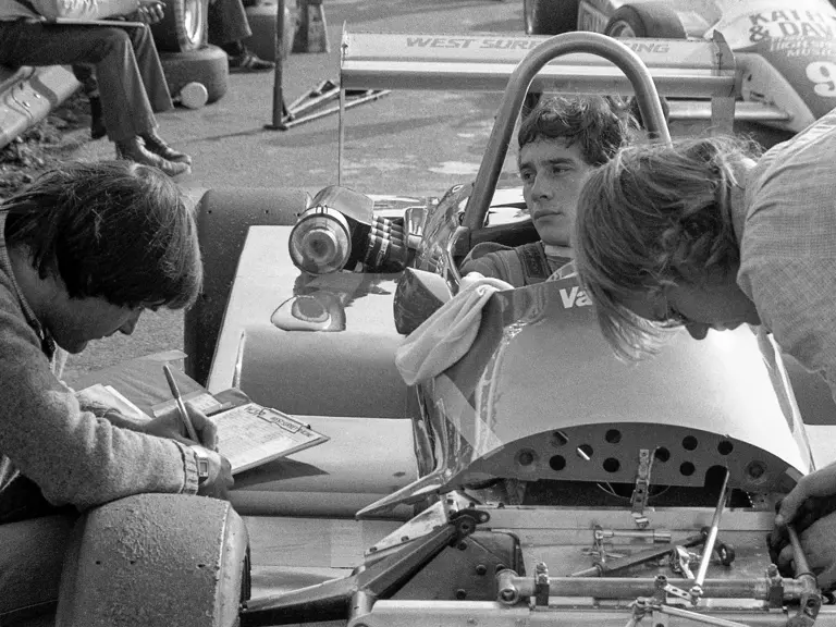 Ayrton Senna sitting in the Ralt RT3 speaks to his mechanics at Thruxton in November of 1982.